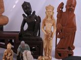 a lot of figurines that are sitting on a table