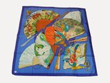 a blue table cloth with many different types of umbrellas on it