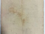 an old piece of paper sitting on top of a table
