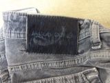 the back of a pair of jeans with a black label on it
