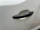 a close up of a car door handle on a white car