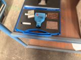 a blue box with a blue handle and a blue handle