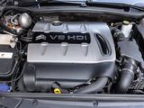 the engine of a car with the hood open and the hood down