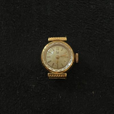an image of a gold watch with roman numerals on the face
