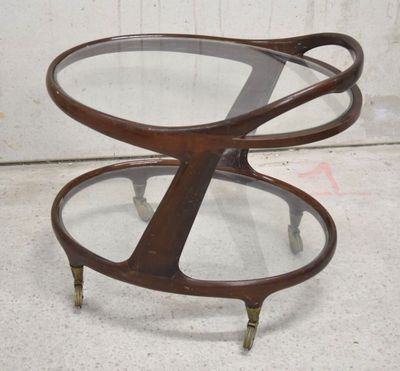 a close up of a table with a glass top and metal legs