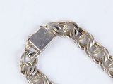 silver chain bracelet with a square clasp on a white background