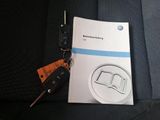 volkswagen service manual and car keys in the back seat of a car