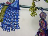a picture of a table cloth with a bunch of tassels on it