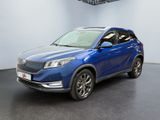 the blue suv is parked in a large room with a black floor