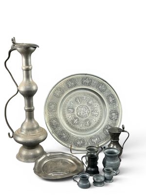 a silver plate and a silver vase and a silver plate and a silver plate and a silver plate and a silver plate and a silver plate and a silver