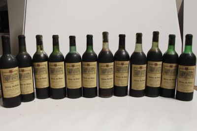 several bottles of wine are lined up in a row on a table