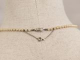 a close up of a necklace on a mannequin mannequin mannequin mannequin mannequin mannequin mannequin mannequin