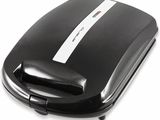 a close up of a toaster on a white surface with a white background