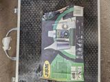 a box of toothbrushes and a box of toothpaste on the floor