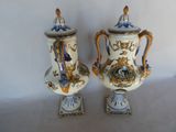 two vases that are sitting on a table