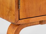 a close up of a wooden cabinet with a drawer on top of it