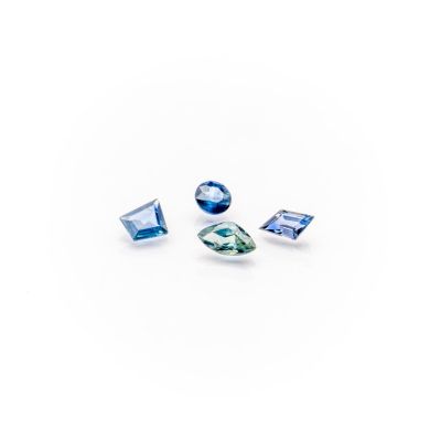 a group of three blue sapphires on a white background