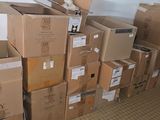 many boxes stacked on top of each other in a room