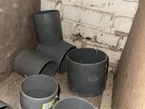 several buckets are lined up against a wall in a room