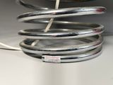 a metal coil that is connected to a lamp