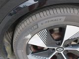 a close up of a tire on a car ' s rim
