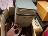 a box full of luggage sitting on the floor
