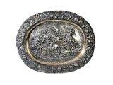 an image of a silver plate with a picture of a man on a horse