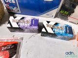 several boxes of cigarettes are sitting on a table next to a box of cigarettes