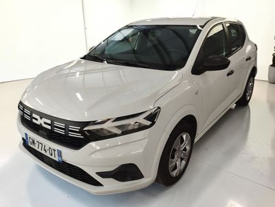 the white car is parked in the white room of the building