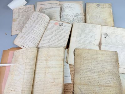a pile of old books on a blue table