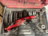 a tool in a tool box with a wren and some other tools