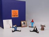 toy figurines of a man in a tuxedo, a cow, a man in a tuxedo, a man in a tuxedo,