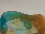 a close up of a glass object on a table