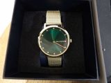 michael korsch watch in a box on a table