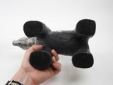 a person holding a black object in their hand