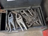 many tools in a tool box on the floor