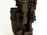 a sculpture of a castle made out of metal pipes