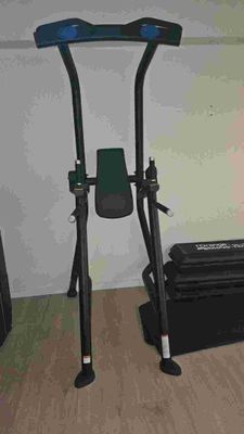 a black and blue exercise equipment in a room