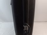 a black suitcase that is sitting on a white surface