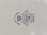 a close up of a plate with a crown on it