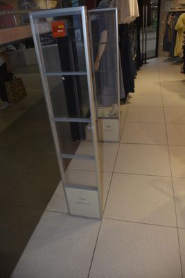 a glass display case in the middle of a store