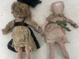 two dolls that are laying next to each other in the snow