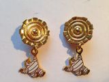 gold plated earrings with a zebra and flower design on them