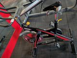 a bike that is sitting on the floor in the gym
