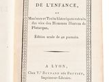 an open book on a white surface with a black border