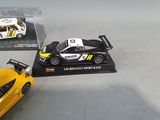 a yellow toy car and a black toy car