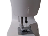 an image of a sewing machine on a white surface