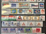an image of a collection of stamps on display in a black frame