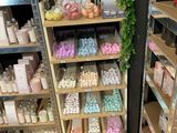 a shelf of soaps and other bath products in a store
