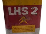 a can of lockhead oil sitting on a white surface